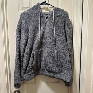 Fuzzy sweatshirt with half zip. Size Medium
